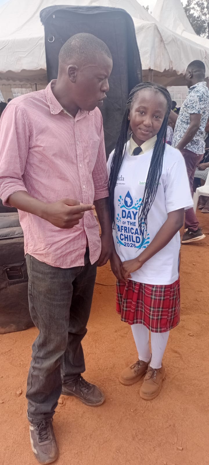 A G4G mentor with a pupil at the Day of the African Child